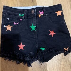 Stella McCartney kids black denim shorts with colorful stars
